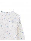 Drusilla Tee with Ruffled Shoulders and Cross-Stitched Flower Appliqué with Lace Trims