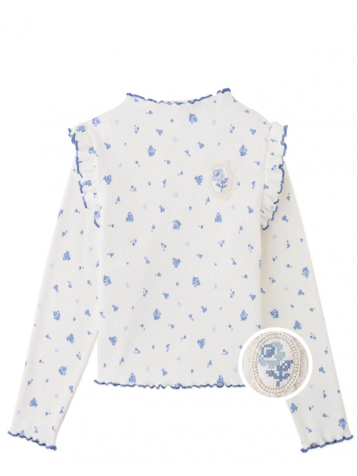 Drusilla Tee with Ruffled Shoulders and Cross-Stitched Flower Appliqué with Lace Trims
